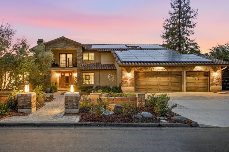 Front elevation at dusk with landscape lighting