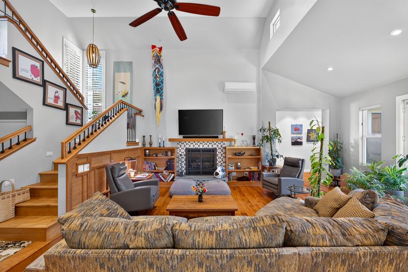 Family room with fireplace and open staircase