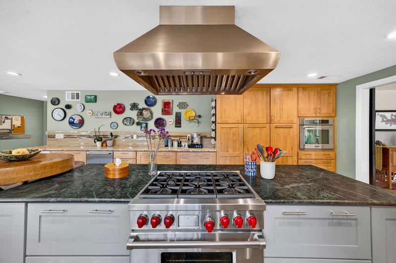 Kitchen with Wolf dual fuel range and stainless hood