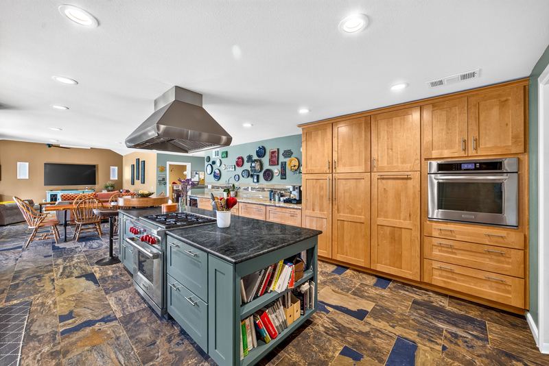 Kitchen island, wall ovens and full height cabinetry