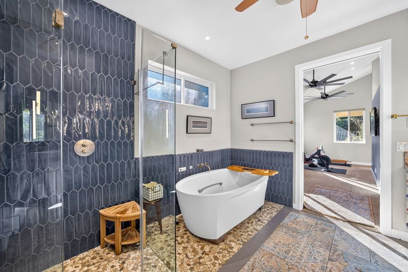 Primary bathroom with freestanding tub and walk in shower